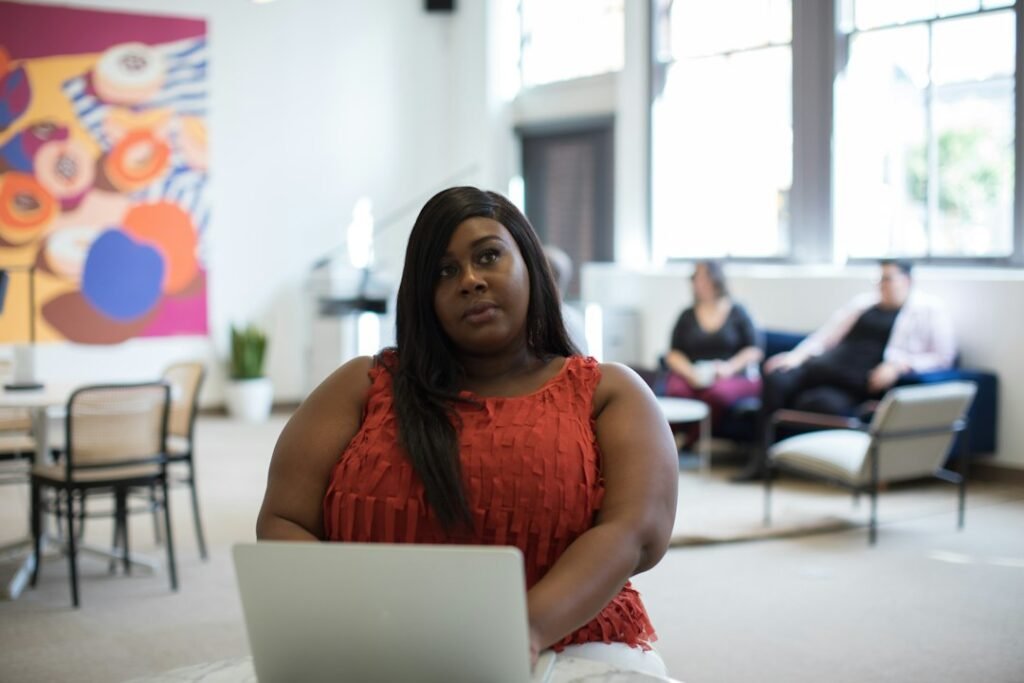 Confident woman working in a bright open office