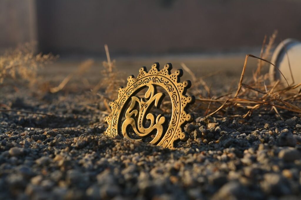 Round brass ornament with a Lord Ganesha design