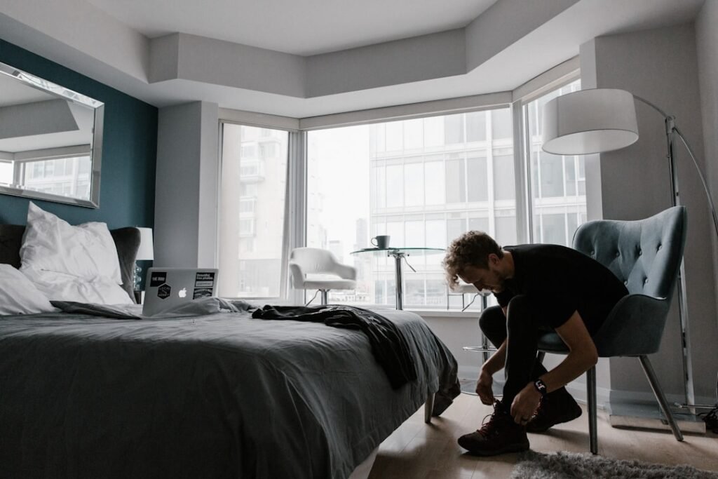 woman sitting bedroom daylight