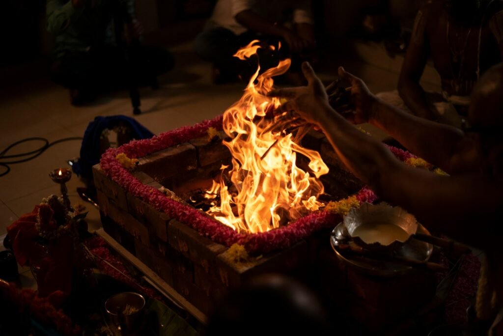 Hindu priest performing a havan fire ceremony puja