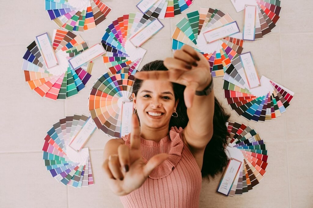 woman holding paint color swatches