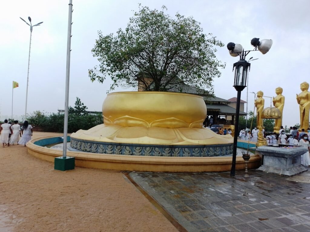 Temple courtyard around a golden statue, representing Ketu remedies