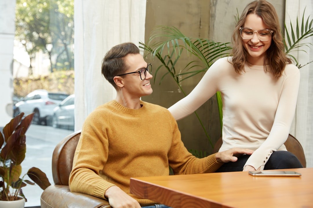 Two people having a warm, trusting conversation in a bright room