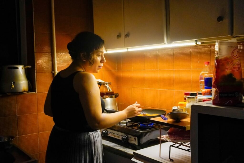 Woman cooking in a bright daylight kitchen