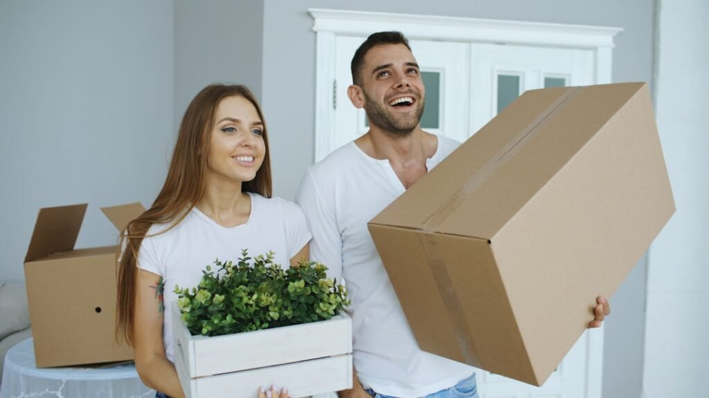 Young couple happily talking in their new apartment