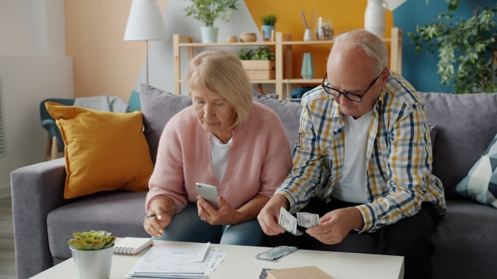 Couple reviewing finances together at home in daylight