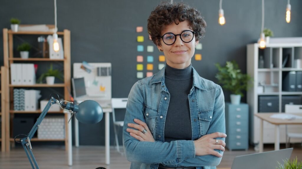 Confident businesswoman smiling in an office with daylight