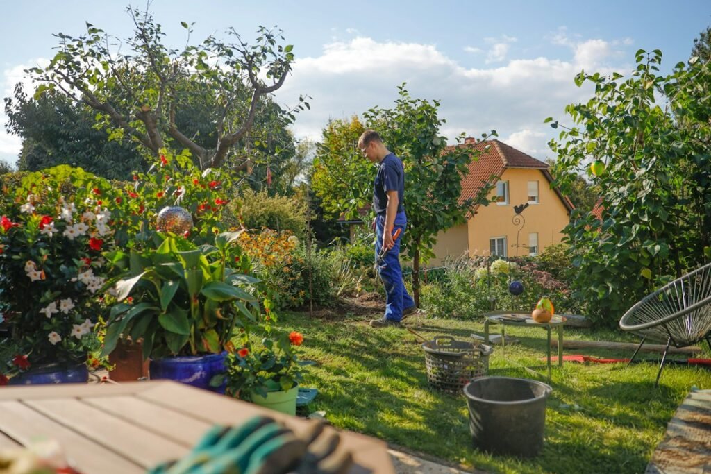 man working garden sunny house exterior