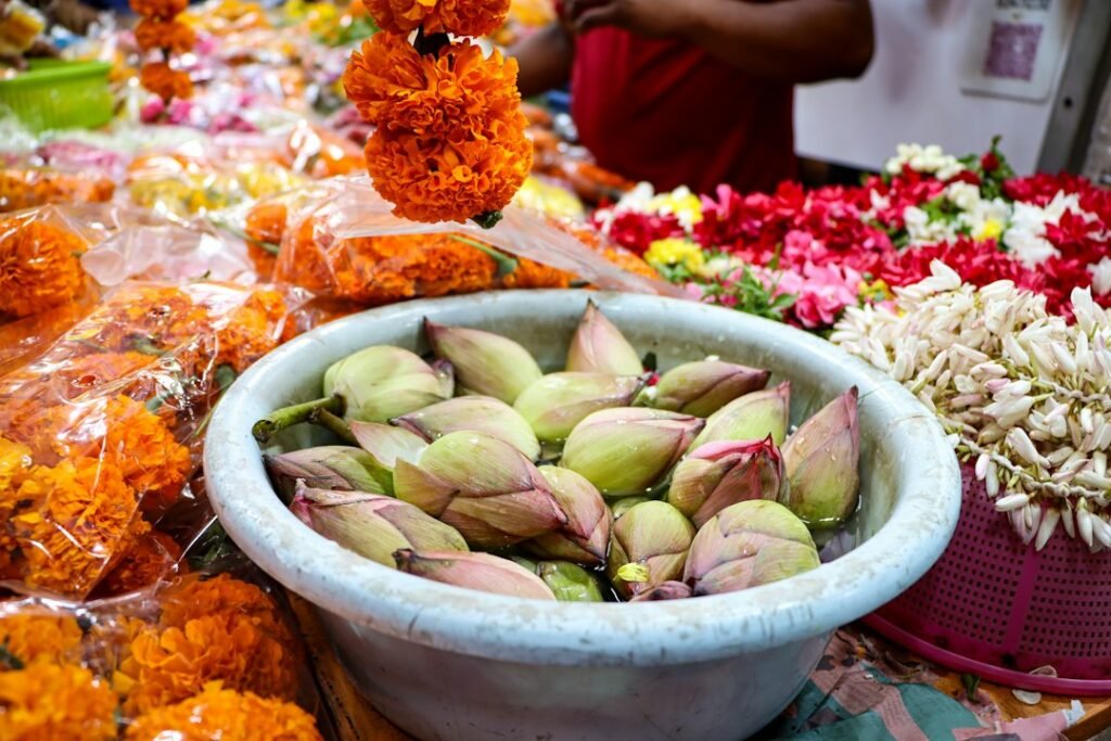 Bowl of lotus buds with marigold garlands, representing Shukra (Venus) remedies
