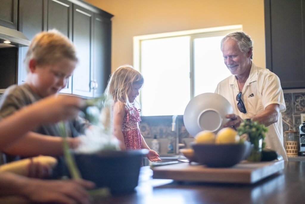 grandfather grandchildren kitchen warm colors