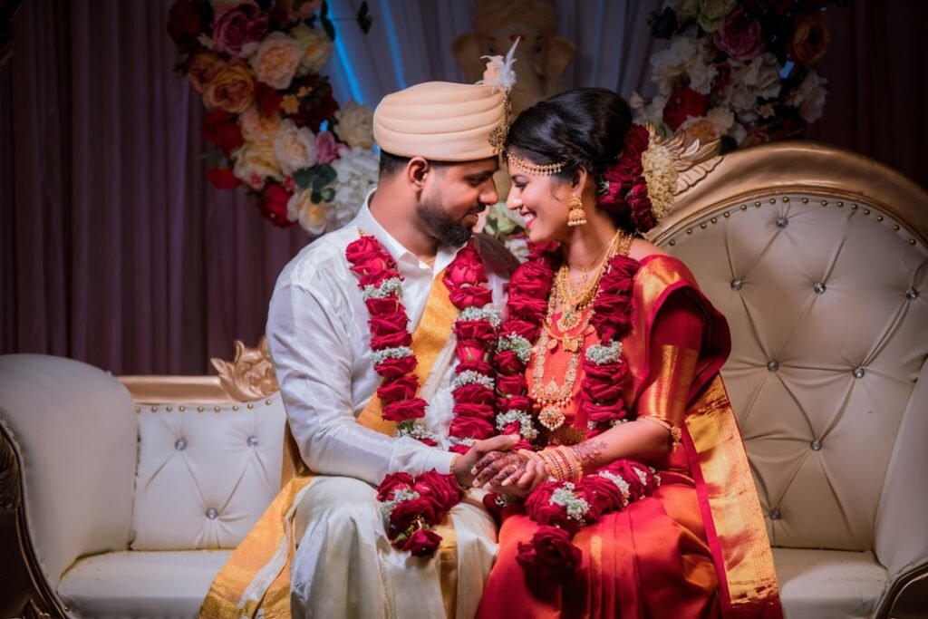 Bride and groom in traditional Indian wedding attire in daylight