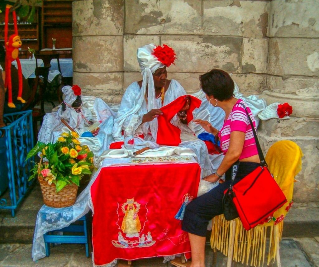 Woman in traditional red attire at a market, representing Mangal (Mars) remedies