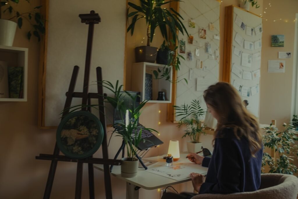 Woman working quietly at a bright corner desk in daylight