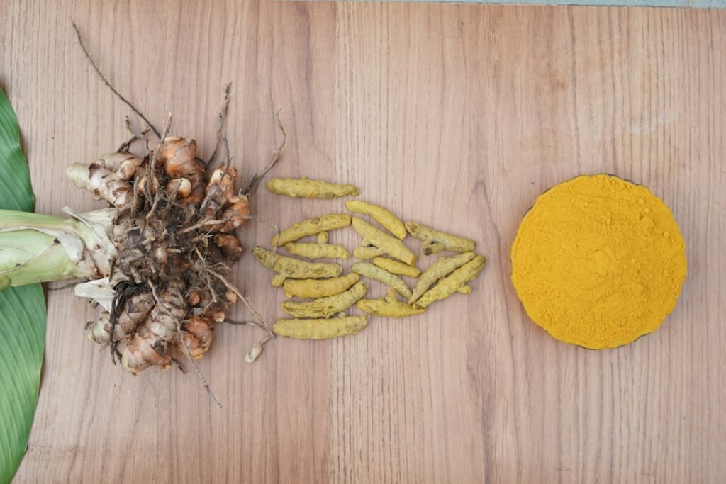 Turmeric root and powder, representing Guru (Jupiter) remedies