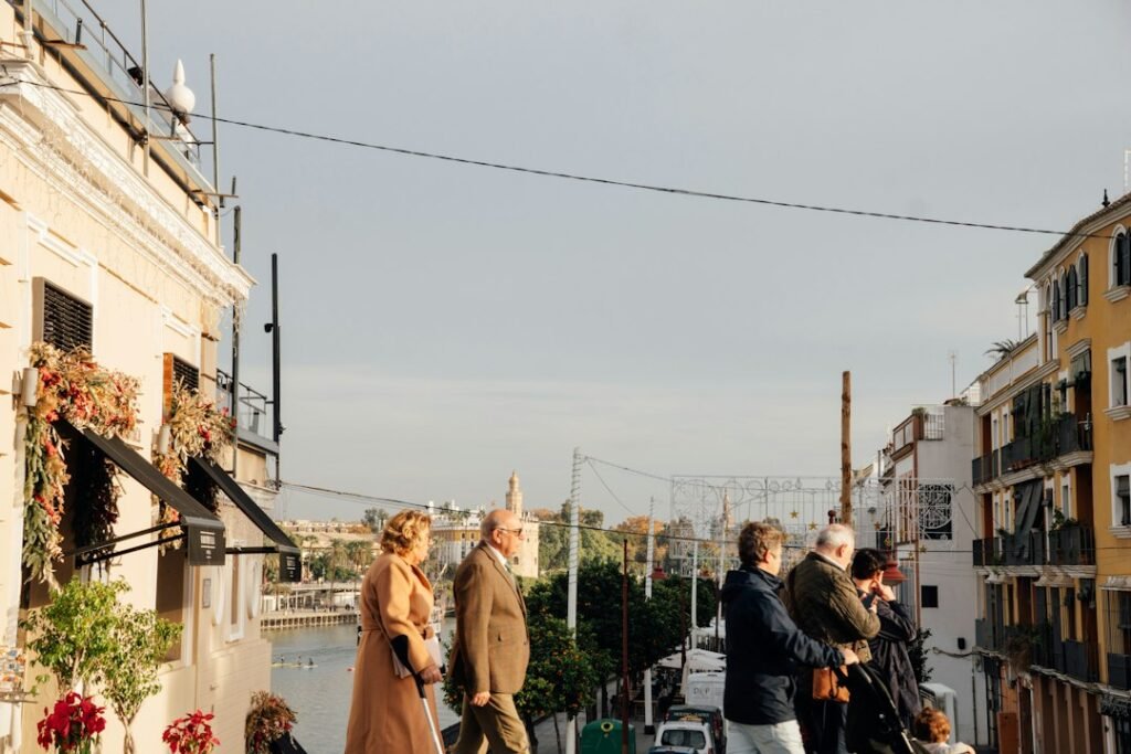 People standing on an apartment balcony overlooking the city in daylight