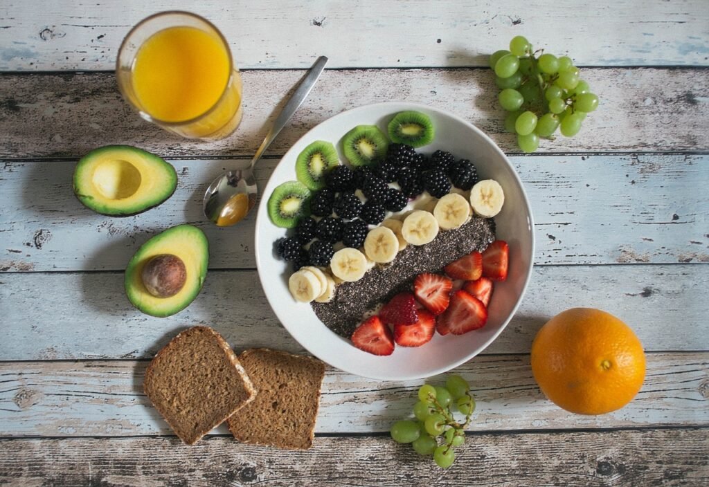 Bowl of fresh fruit on a wooden table for a fasting day