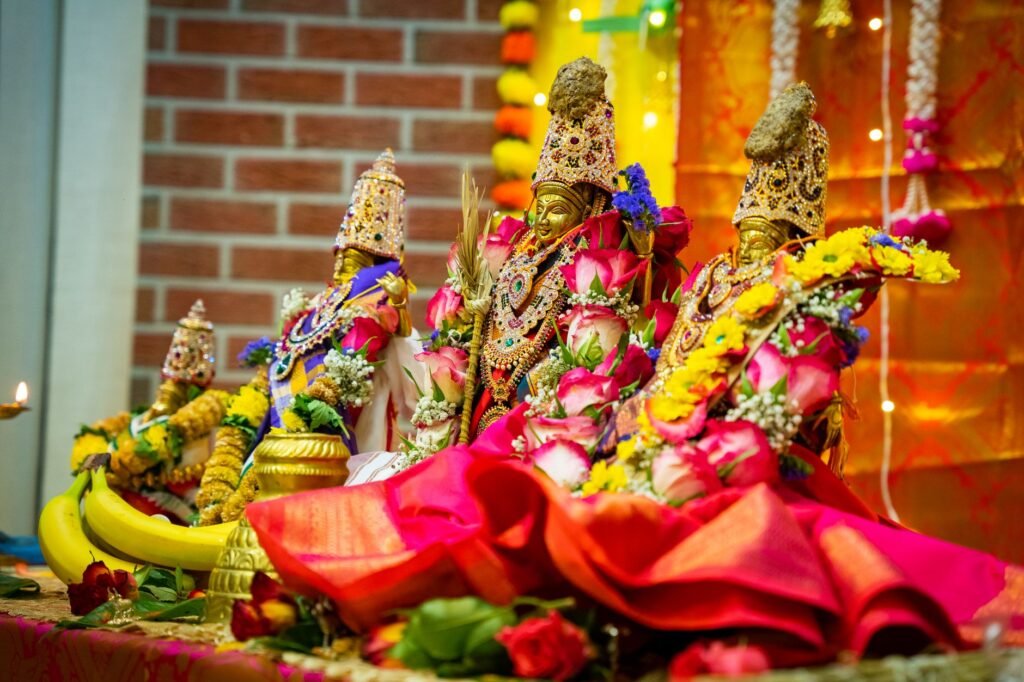 Hindu deity murtis adorned with colourful fresh flowers