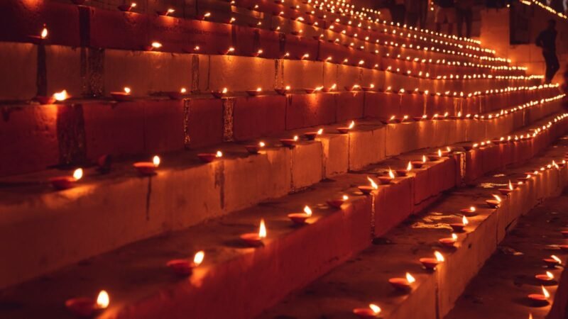 Rows of lit earthen diyas along steps for Naraka Chaturdashi Deepdaan