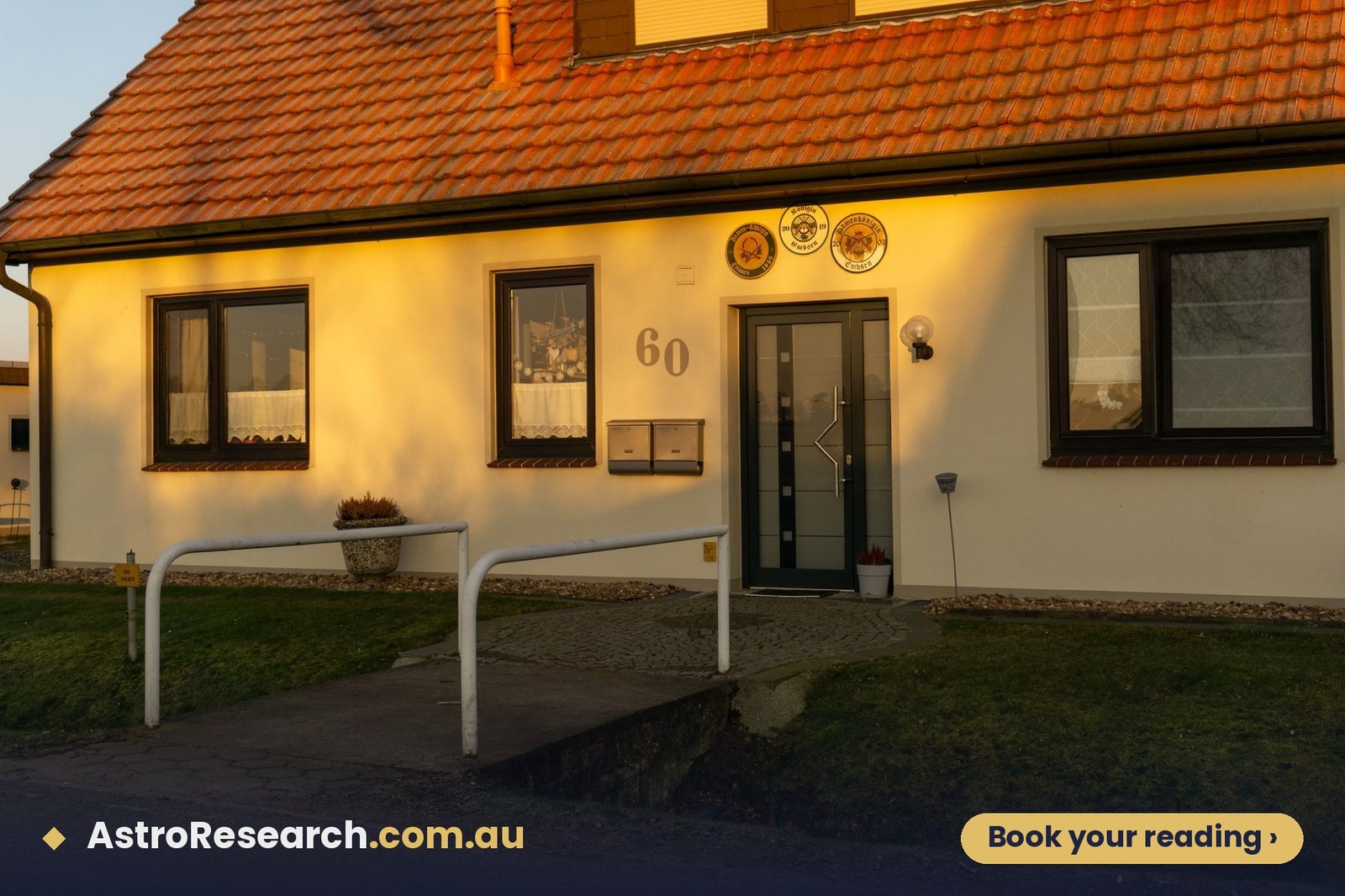 Welcoming home entrance glowing in warm late-afternoon light, the evening sun a west-facing house receives