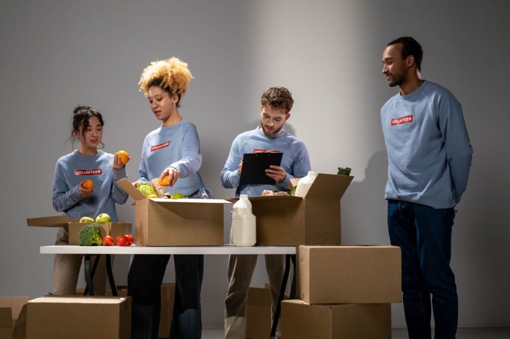 Volunteers from different backgrounds packing food donations