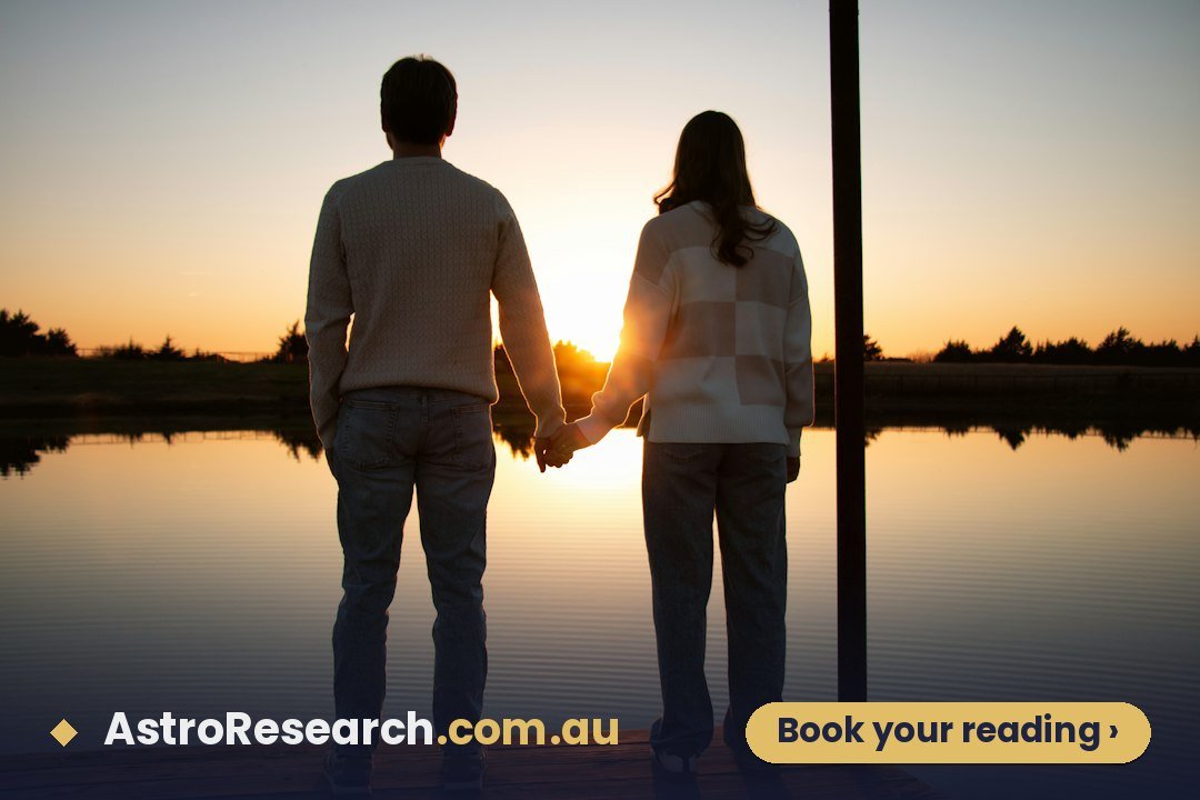 Couple holding hands while watching a warm sunset over a lake, illustrating marriage and partnership in the Navamsa (D9) chart